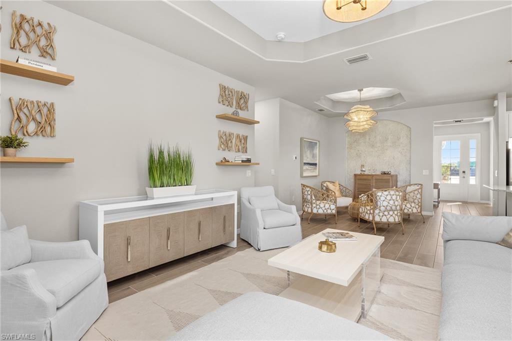 15048 Redbud Lane Punta Gorda, FL 33955 - Photo 5 of 34 a living room with furniture and a large window