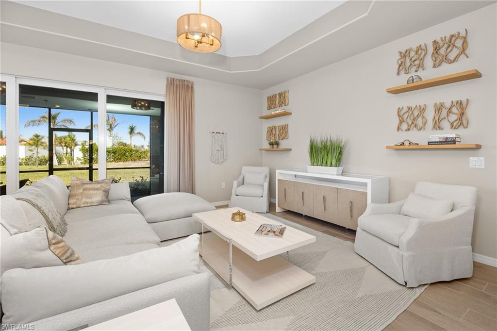 15048 Redbud Lane Punta Gorda, FL 33955 - Photo 6 of 34 a living room with furniture and a table