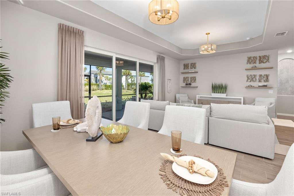15048 Redbud Lane Punta Gorda, FL 33955 - Photo 10 of 34 a living room with furniture and a table