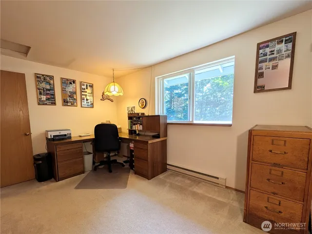 a bathroom with a granite countertop sink a toilet and bathtub