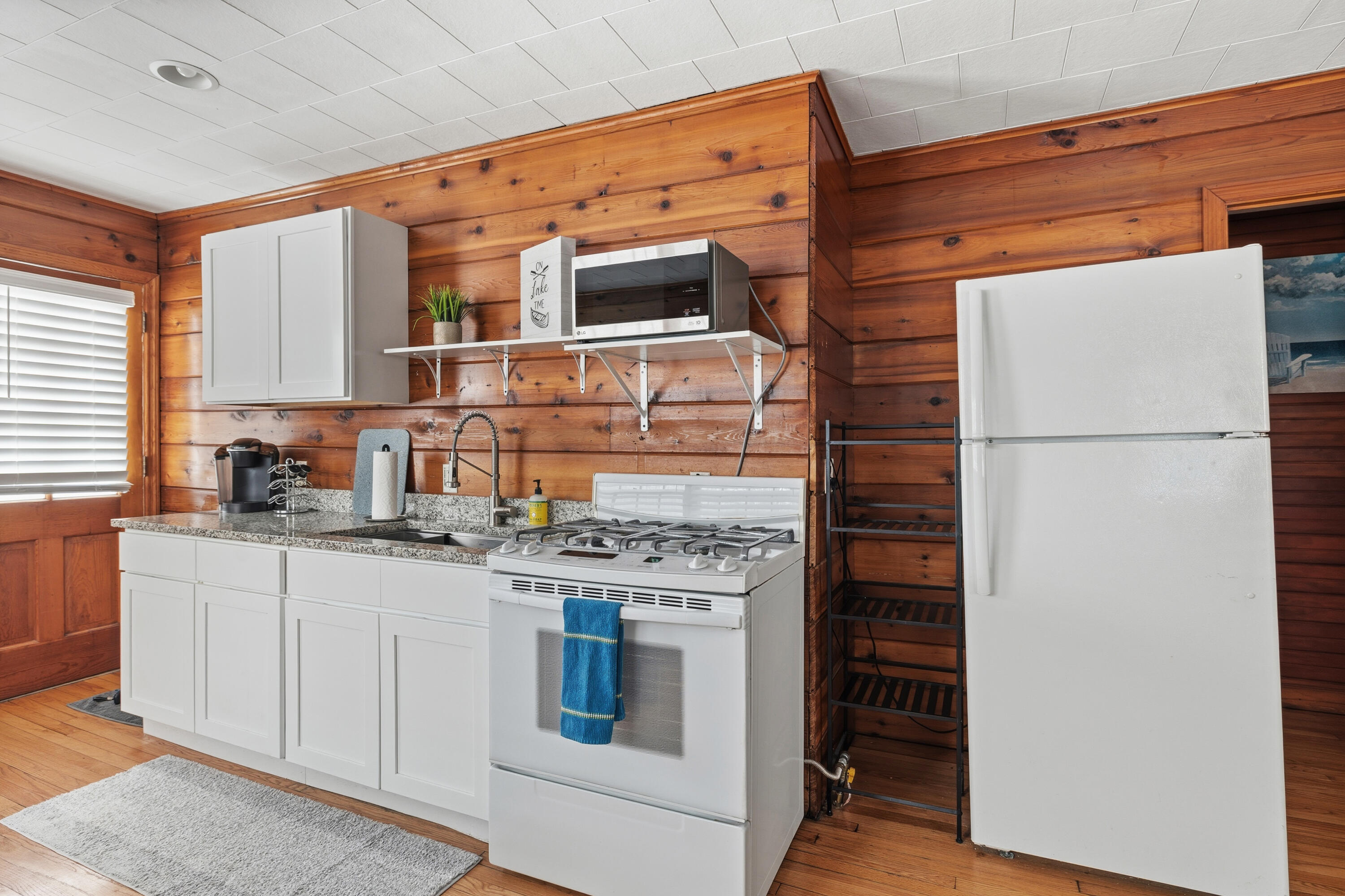 292 Grayson Road La Porte, IN 46350 - Photo 18 of 27 a kitchen with stainless steel appliances a stove and a refrigerator