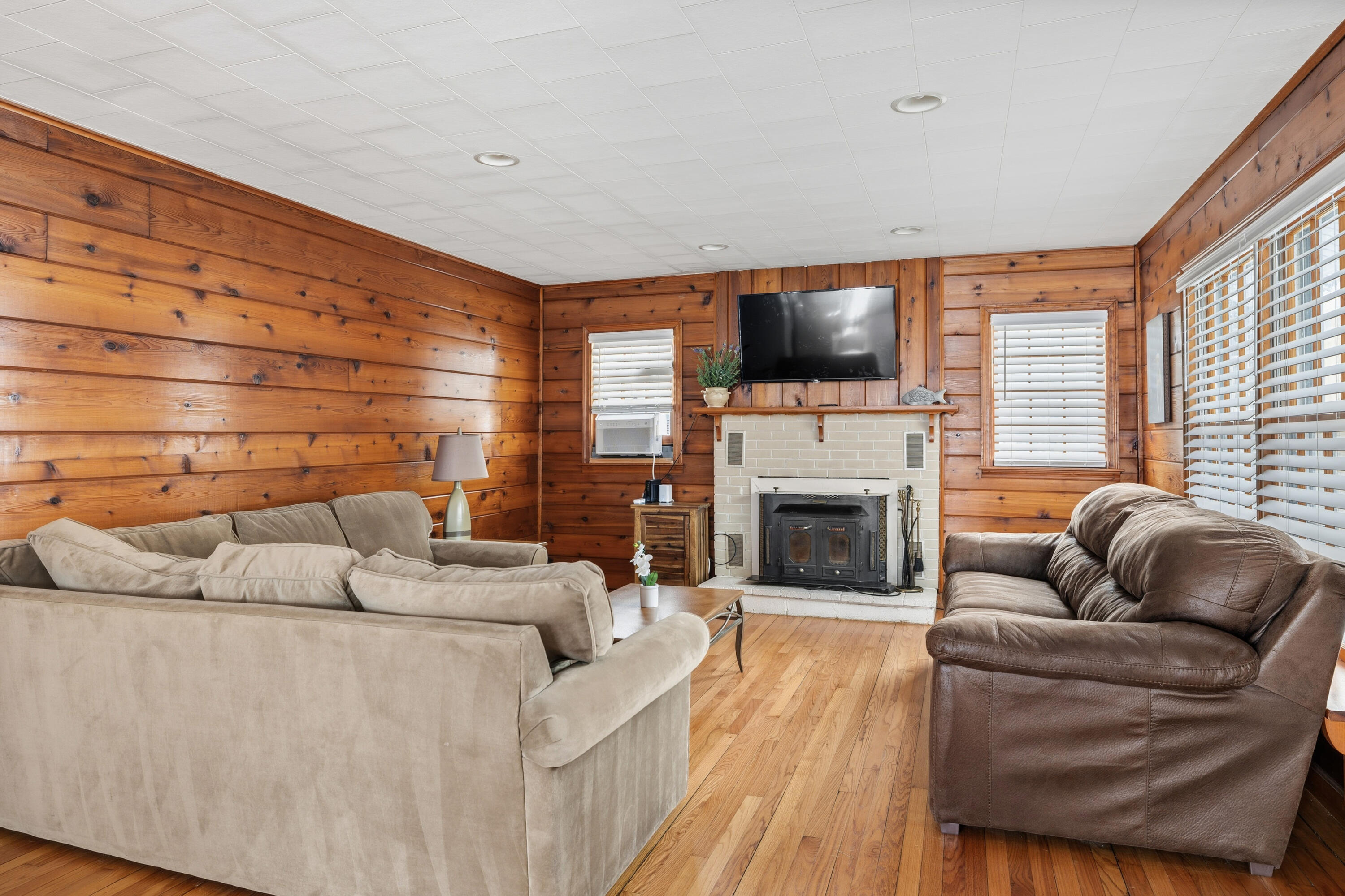 292 Grayson Road La Porte, IN 46350 - Photo 21 of 27 a living room with furniture a flat screen tv and a fireplace