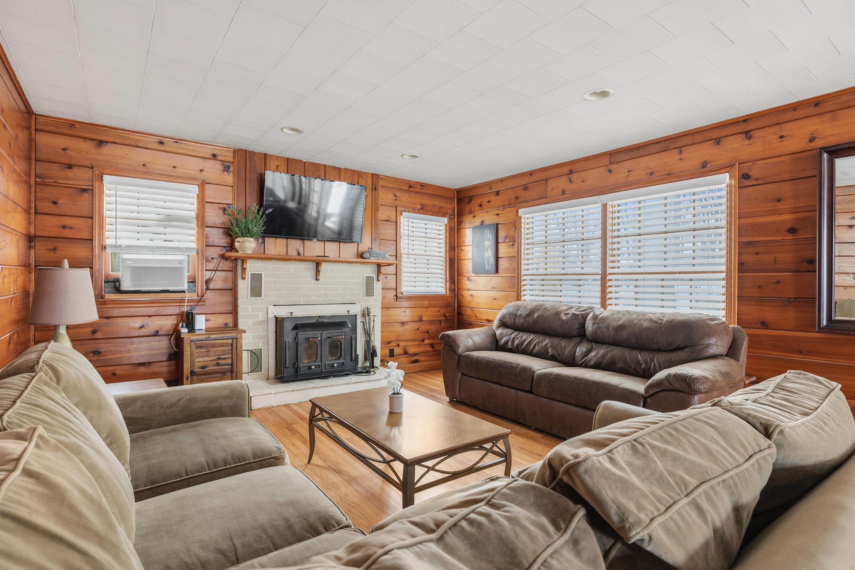292 Grayson Road La Porte, IN 46350 - Photo 5 of 27 a living room with furniture a large window and a fireplace