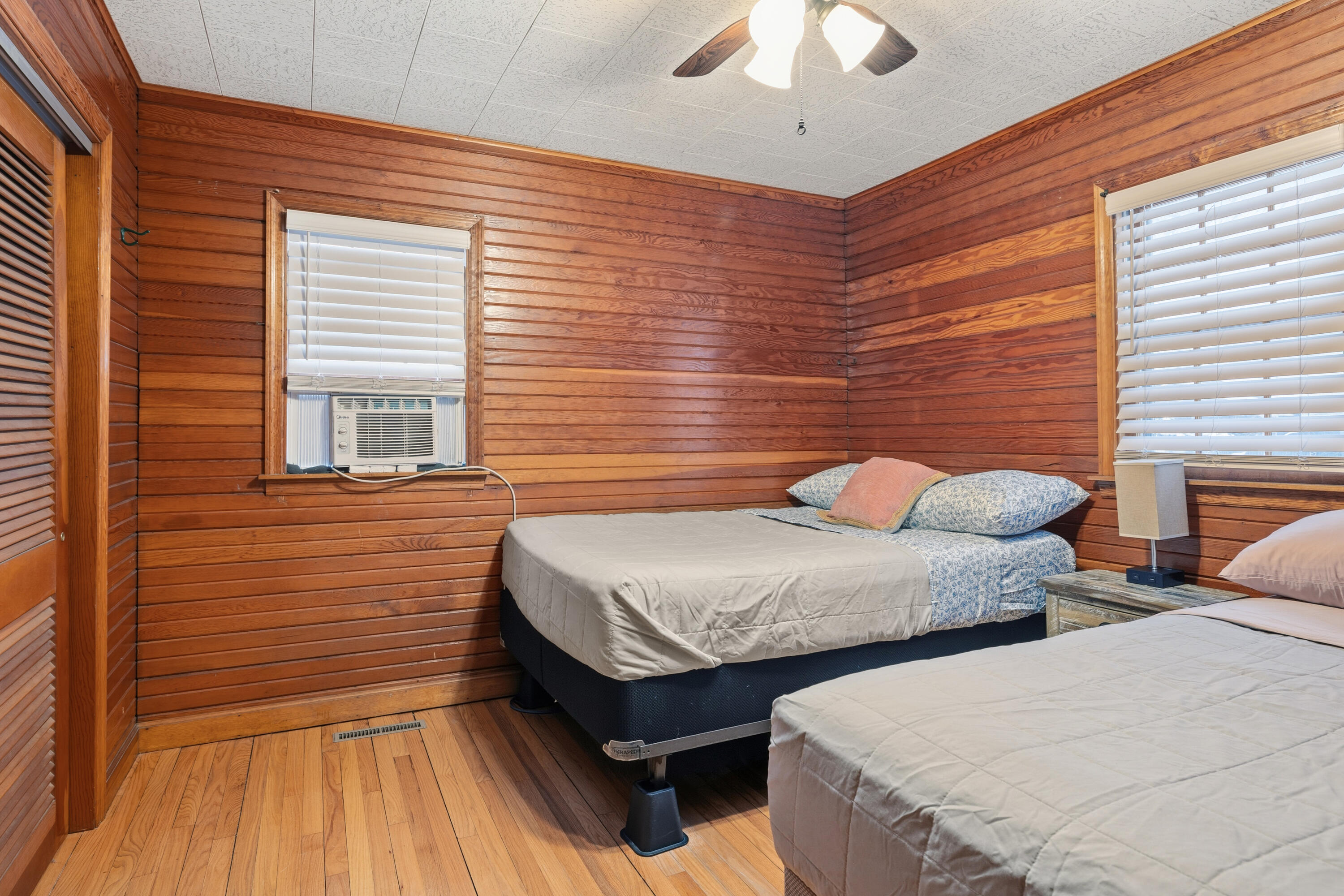 292 Grayson Road La Porte, IN 46350 - Photo 7 of 27 a bedroom with two beds and a chandelier