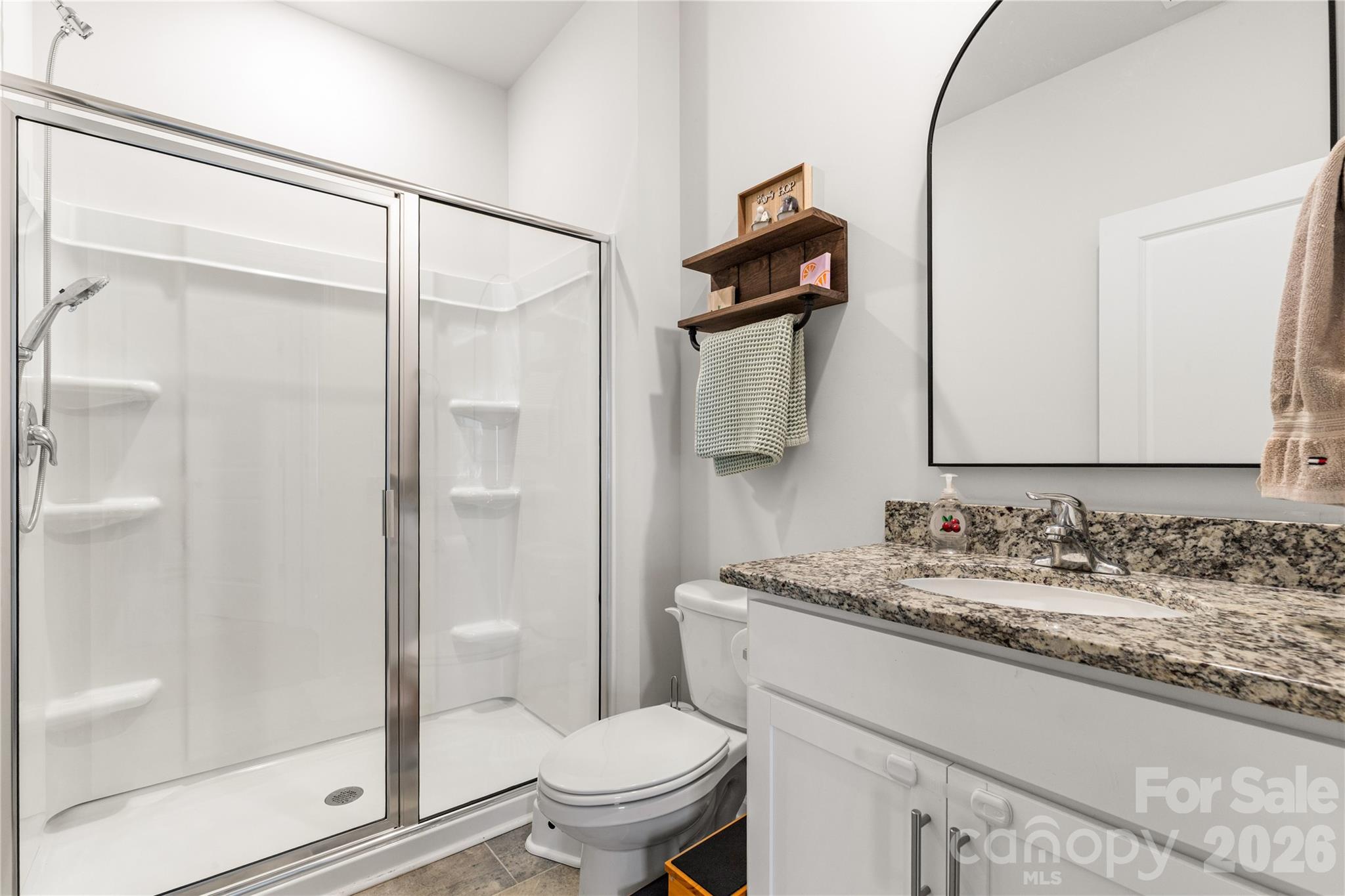 559 King Clover Lane Clover, SC 29710 - Photo 14 of 34 a bathroom with a granite countertop sink toilet and shower
