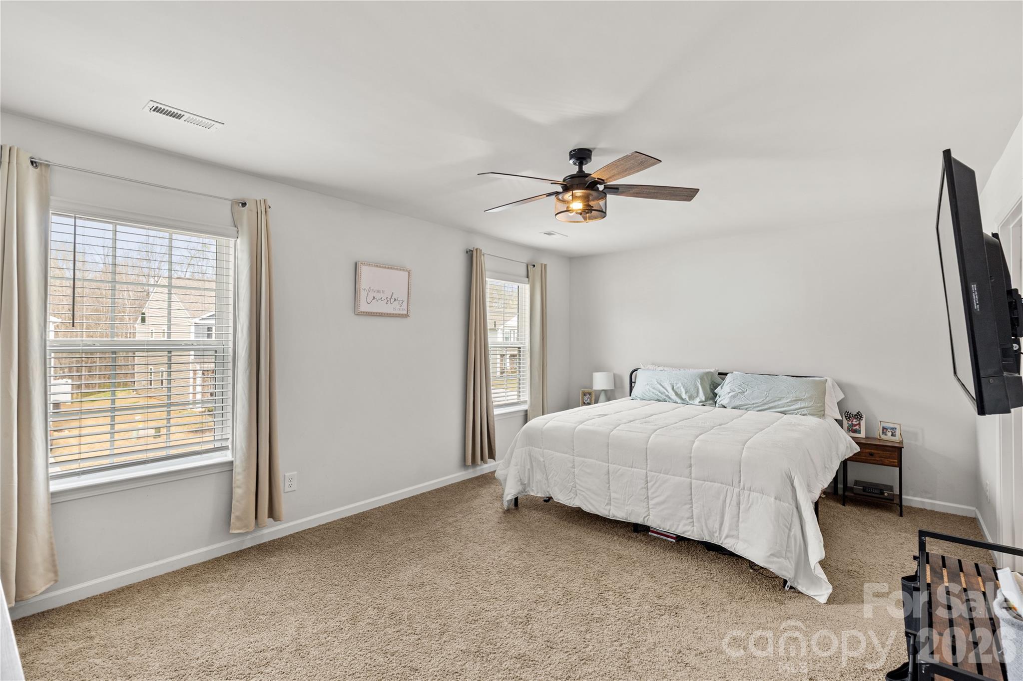 559 King Clover Lane Clover, SC 29710 - Photo 15 of 34 a bedroom with a bed a couch and a window