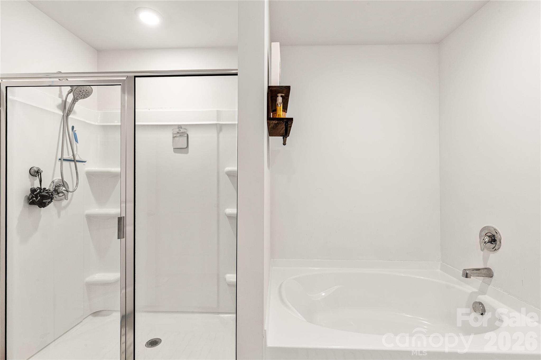 559 King Clover Lane Clover, SC 29710 - Photo 17 of 34 a bathroom with a bathtub and shower