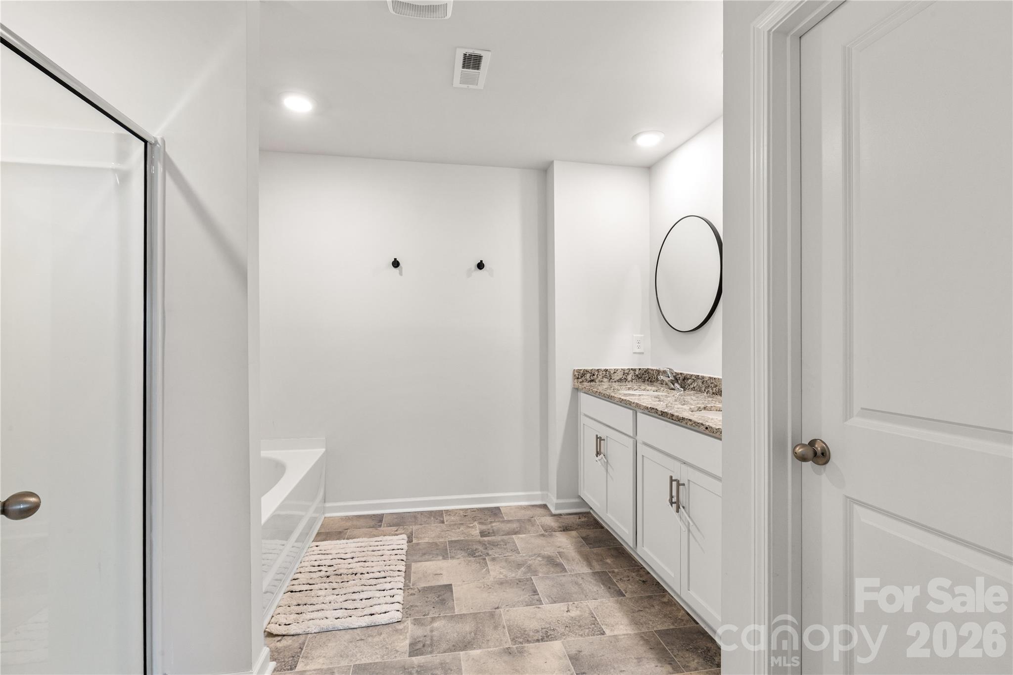 559 King Clover Lane Clover, SC 29710 - Photo 19 of 34 a bathroom with a granite countertop sink and a mirror