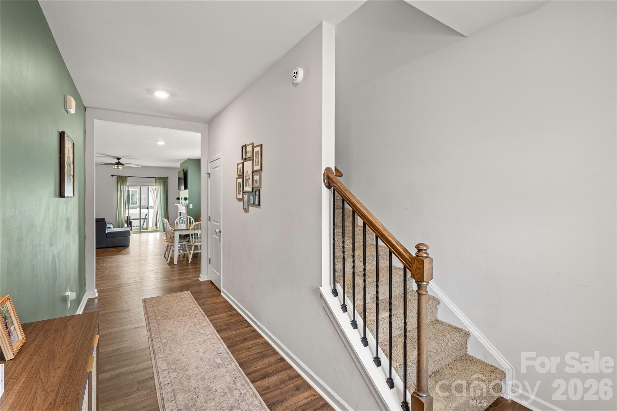 559 King Clover Lane Clover, SC 29710 - Photo 3 of 34 a view of a hallway with wooden floor and staircase