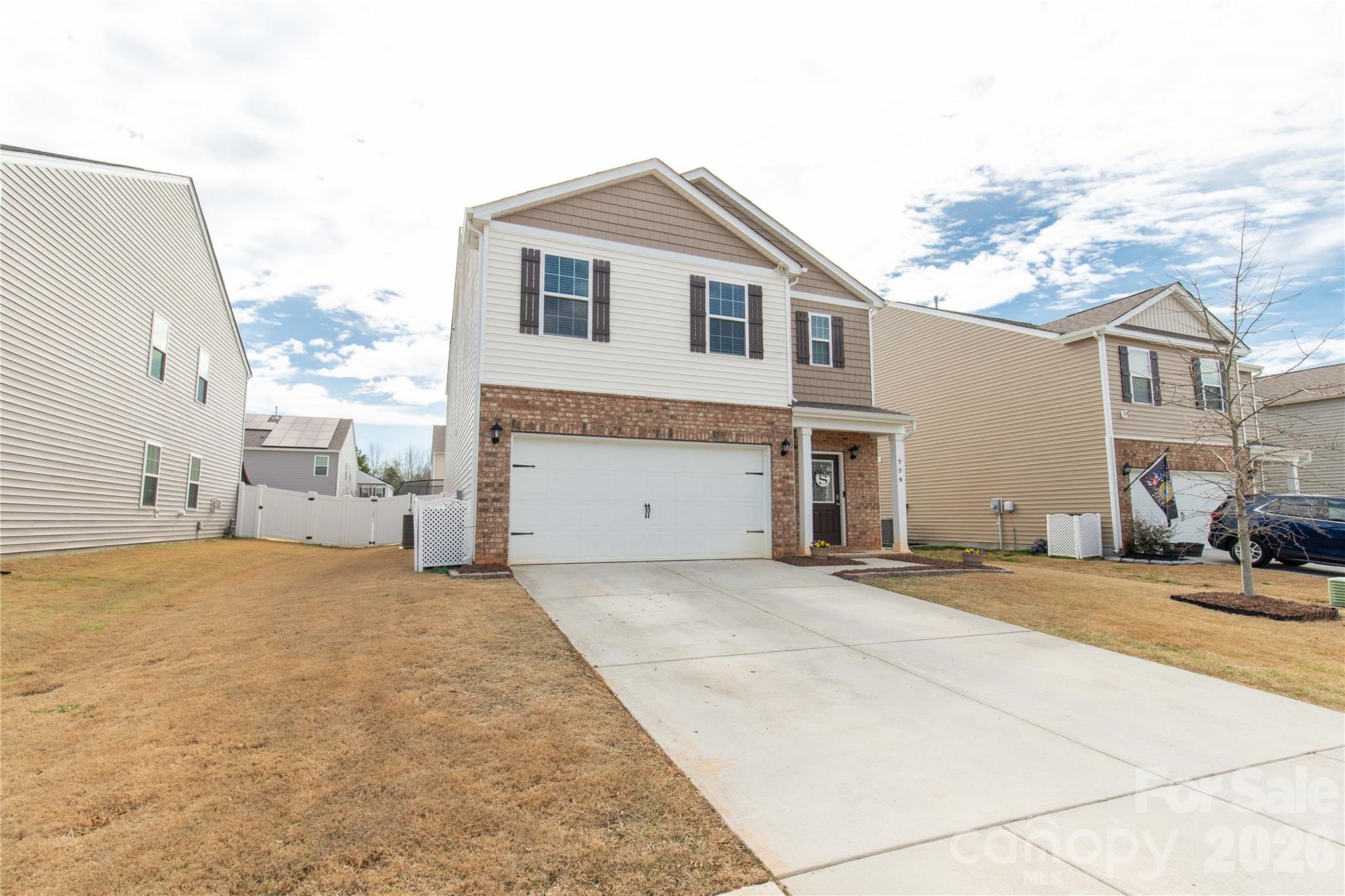 559 King Clover Lane Clover, SC 29710 - Photo 31 of 34 a big house with a large parking space and windows