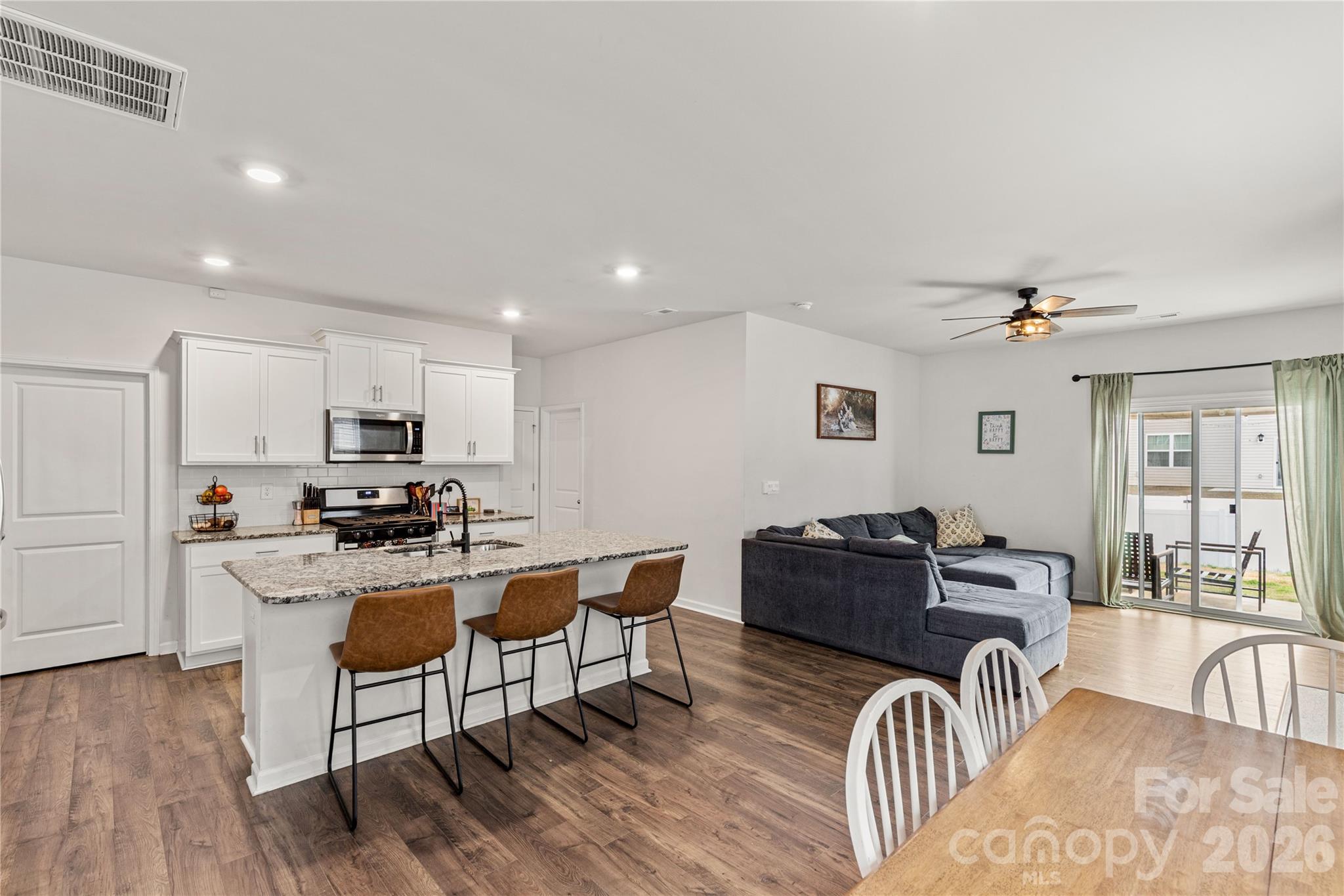 559 King Clover Lane Clover, SC 29710 - Photo 5 of 34 a living room with furniture a dining table and chairs with wooden floor