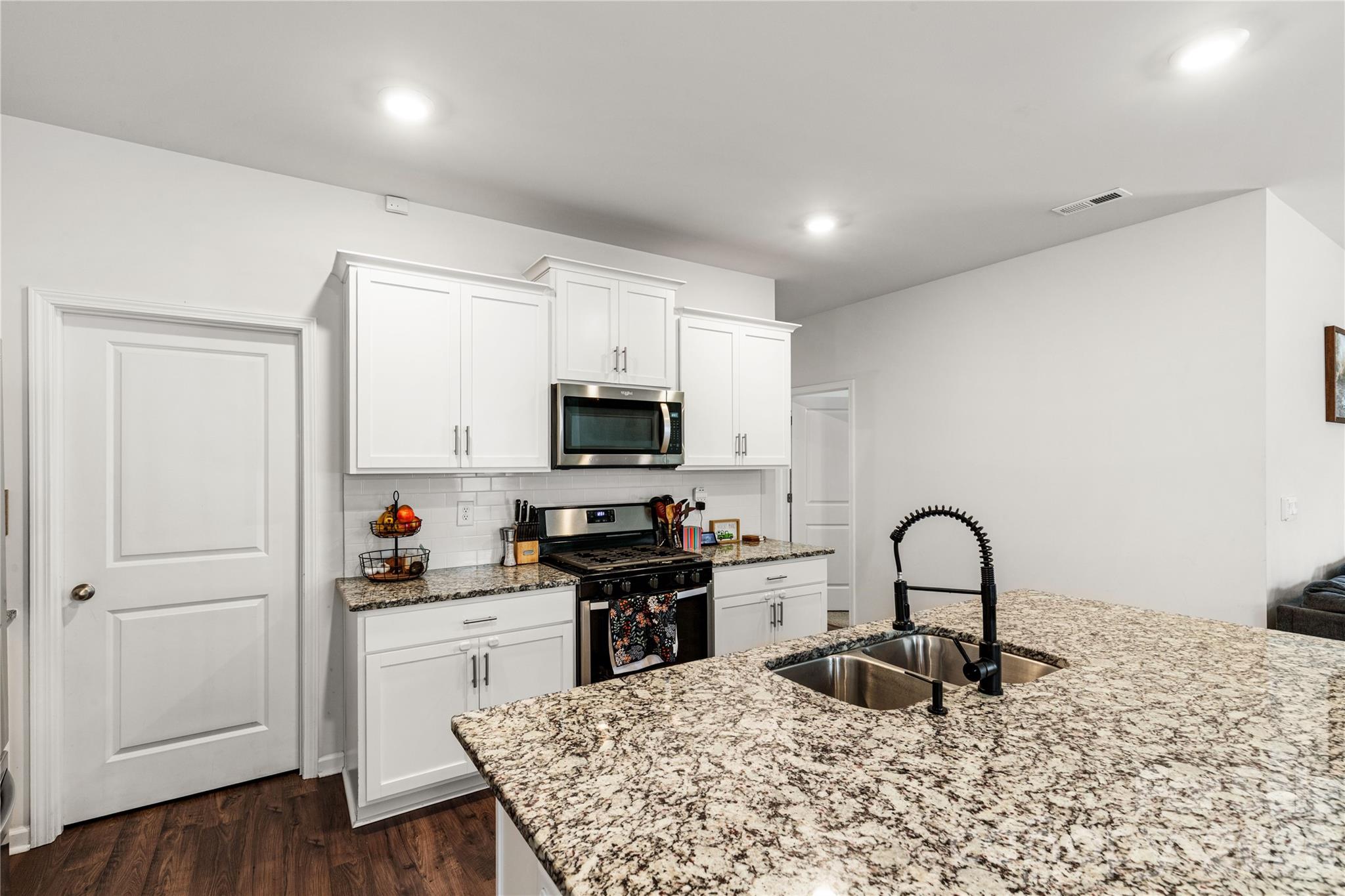 559 King Clover Lane Clover, SC 29710 - Photo 6 of 34 a kitchen with sink a microwave and cabinets