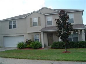 1801 Valley Ridge Loop Clermont, FL 34711 - Photo 1 of 1 a house that has a tree in front of it