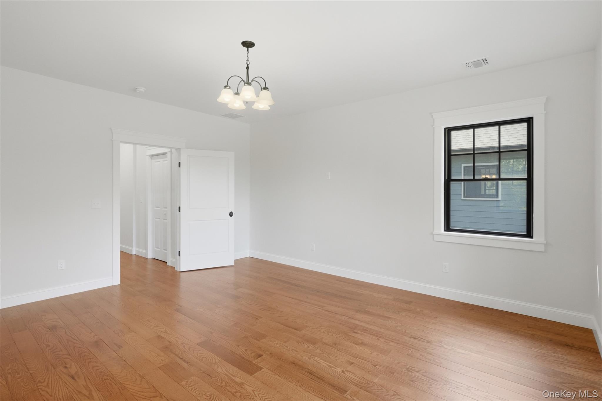 300 Van Tuyl Road Barryville, NY 12719 - Photo 34 of 50 a view of an empty room with wooden floor and a window