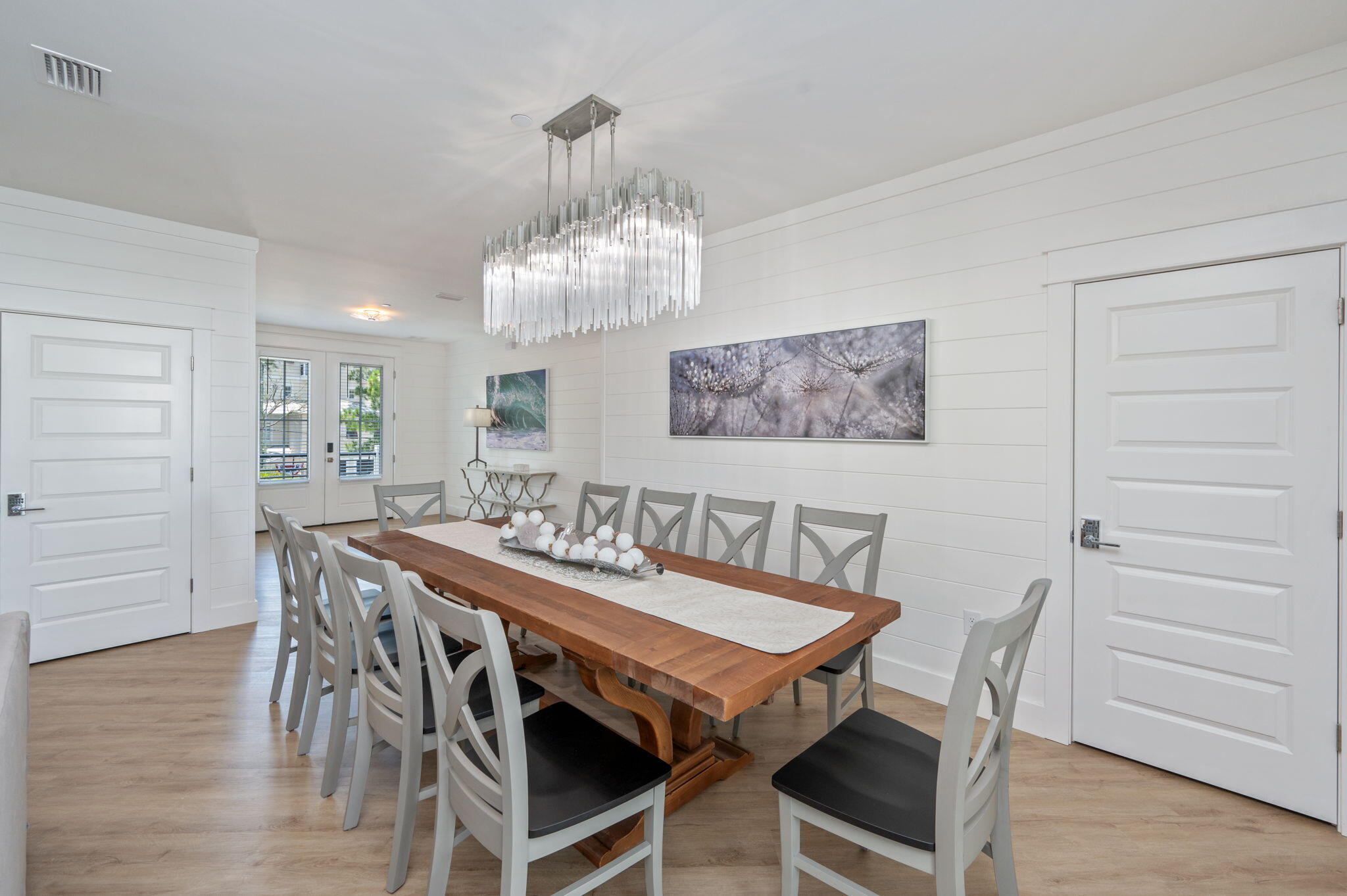 6508 West County Highway 30A Santa Rosa Beach, FL 32459 - Photo 12 of 75 a view of a dining room with furniture and wooden floor