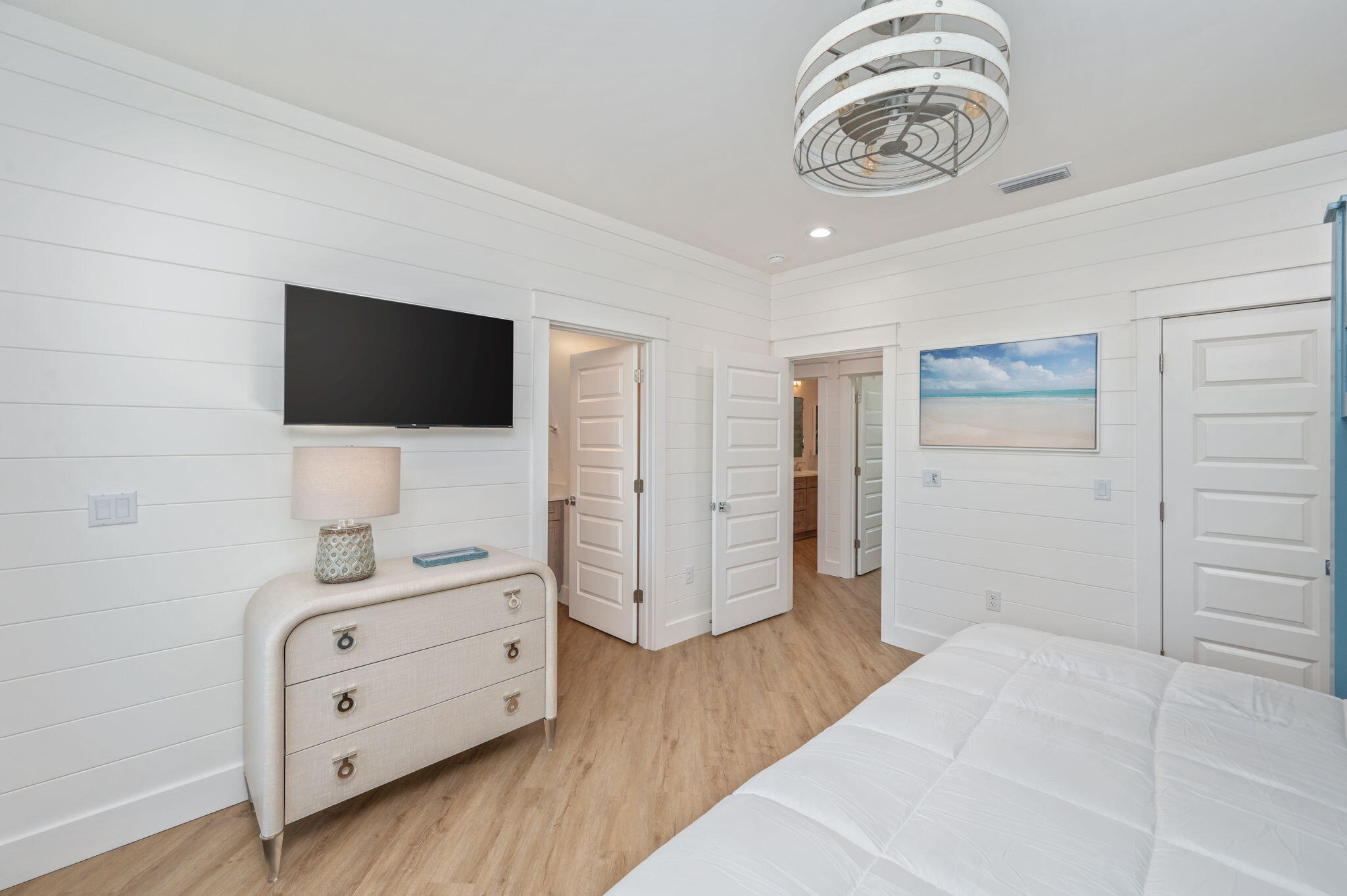 6508 West County Highway 30A Santa Rosa Beach, FL 32459 - Photo 25 of 75 a bedroom with a bed and a flat screen tv