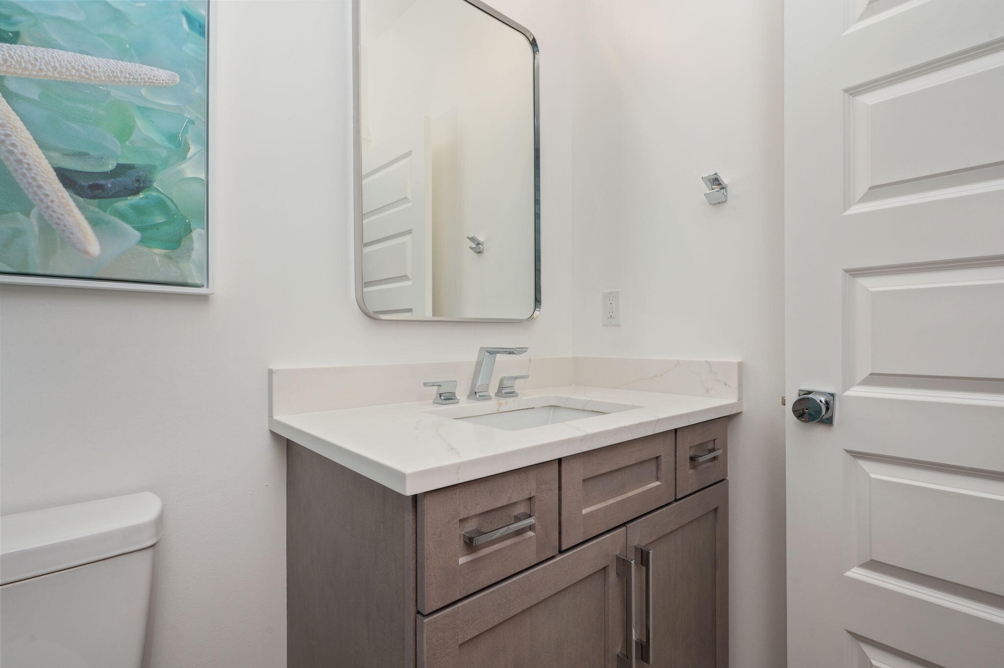 6508 West County Highway 30A Santa Rosa Beach, FL 32459 - Photo 37 of 75 a bathroom with a sink toilet and mirror