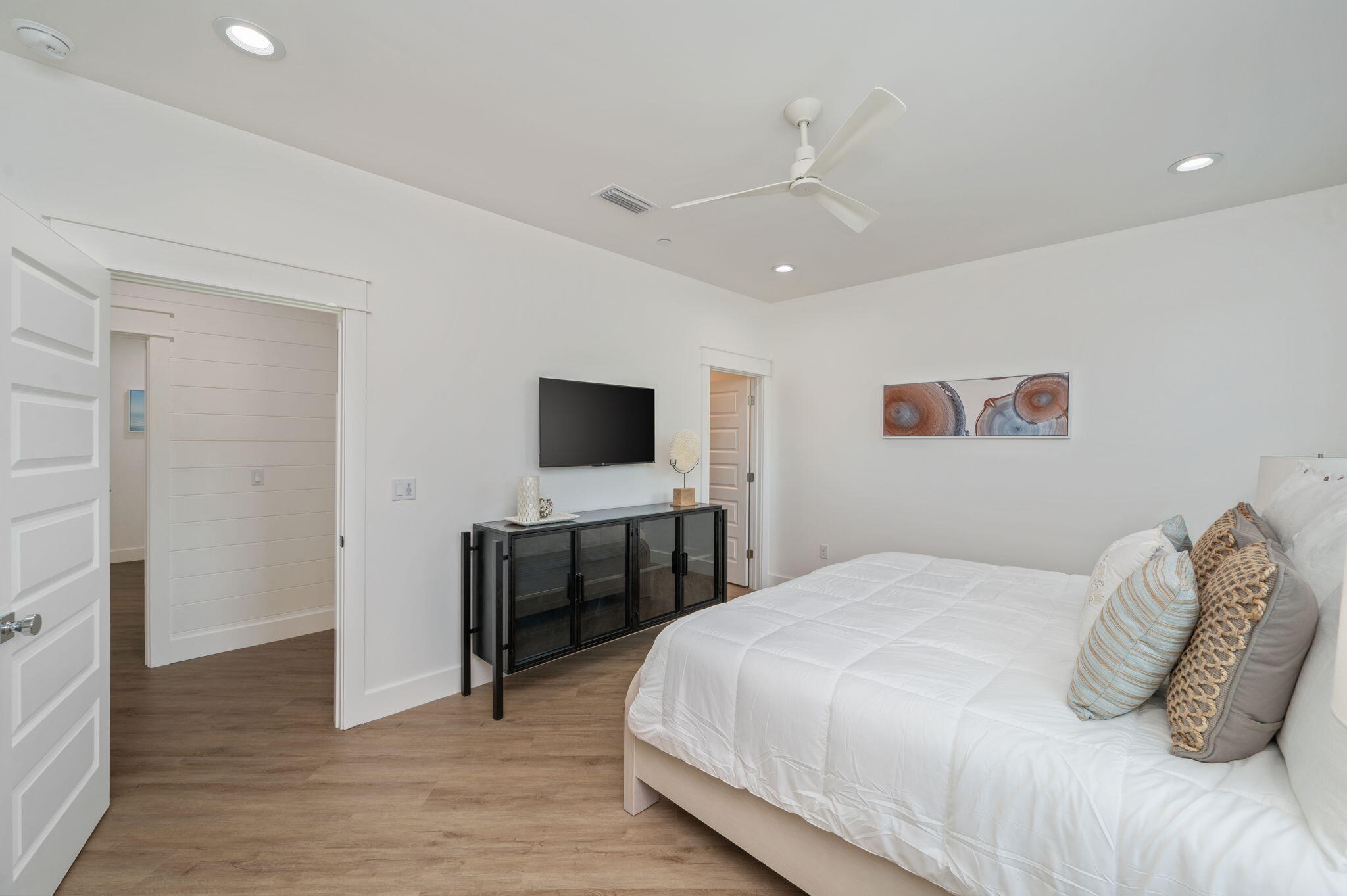 6508 West County Highway 30A Santa Rosa Beach, FL 32459 - Photo 44 of 75 a bedroom with a bed and a flat screen tv