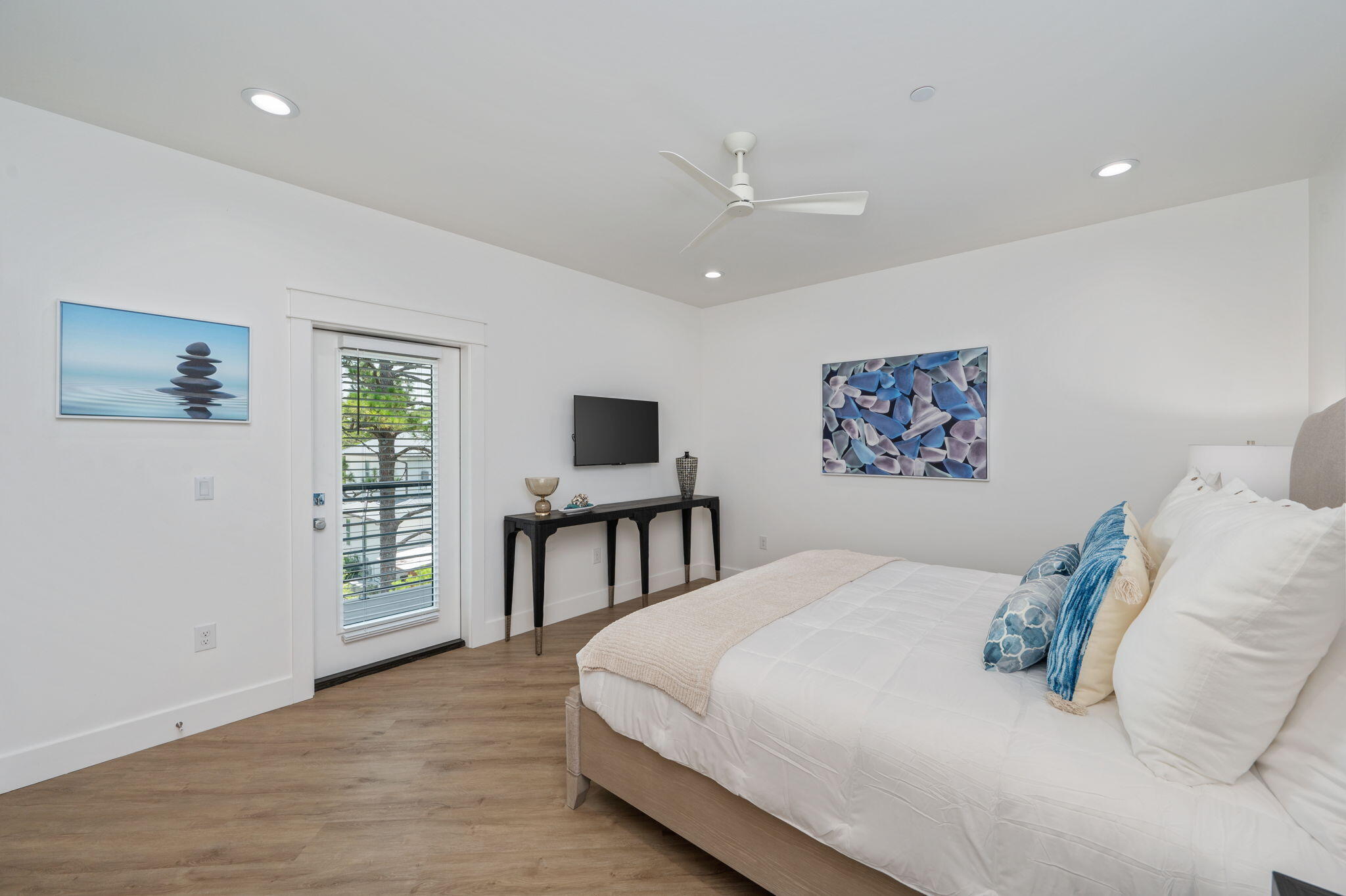 6508 West County Highway 30A Santa Rosa Beach, FL 32459 - Photo 49 of 75 a bedroom with a large bed and a painting on the wall