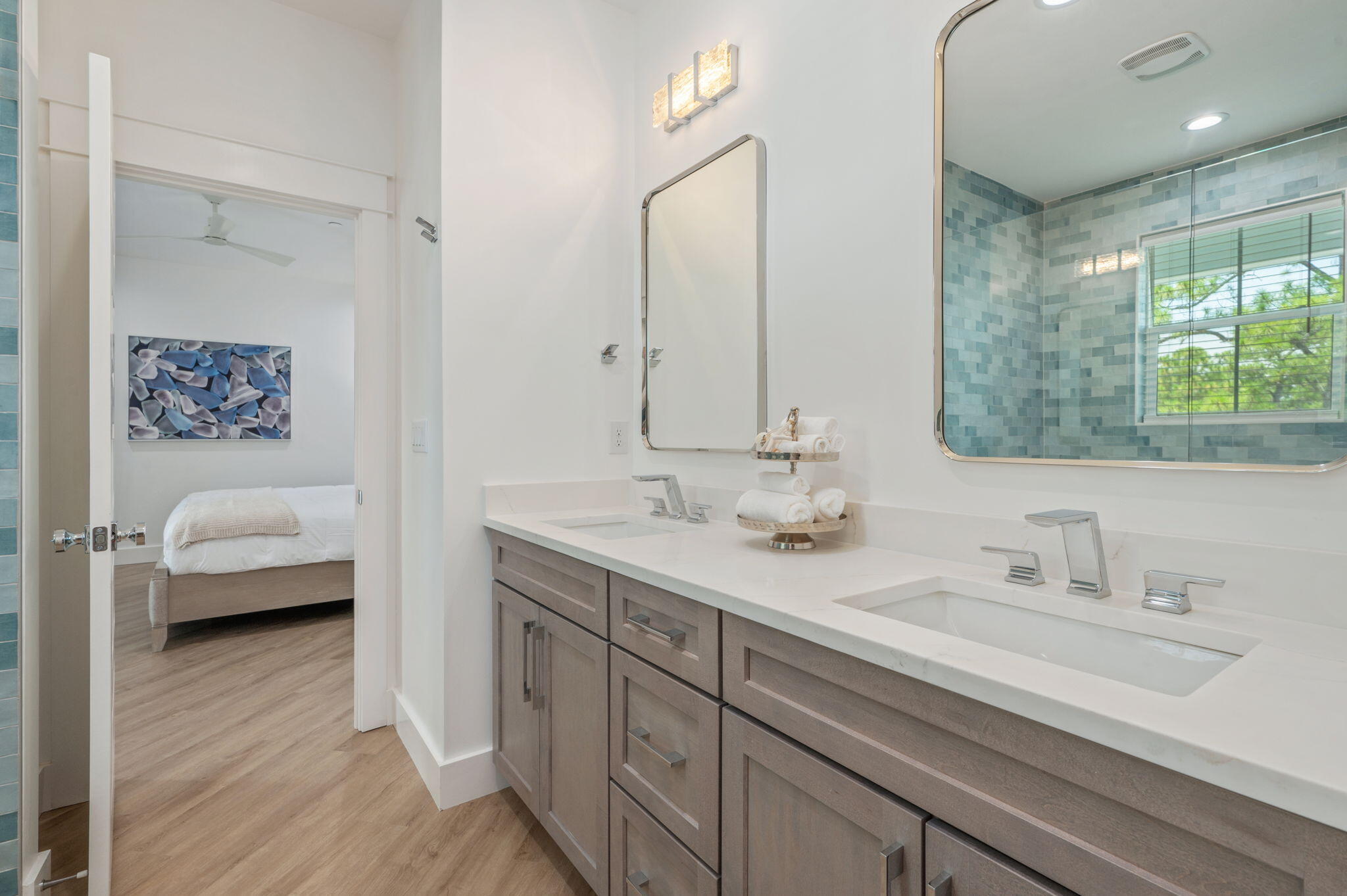 6508 West County Highway 30A Santa Rosa Beach, FL 32459 - Photo 51 of 75 a en suite bathroom with a double vanity sink a mirror and a bathtub