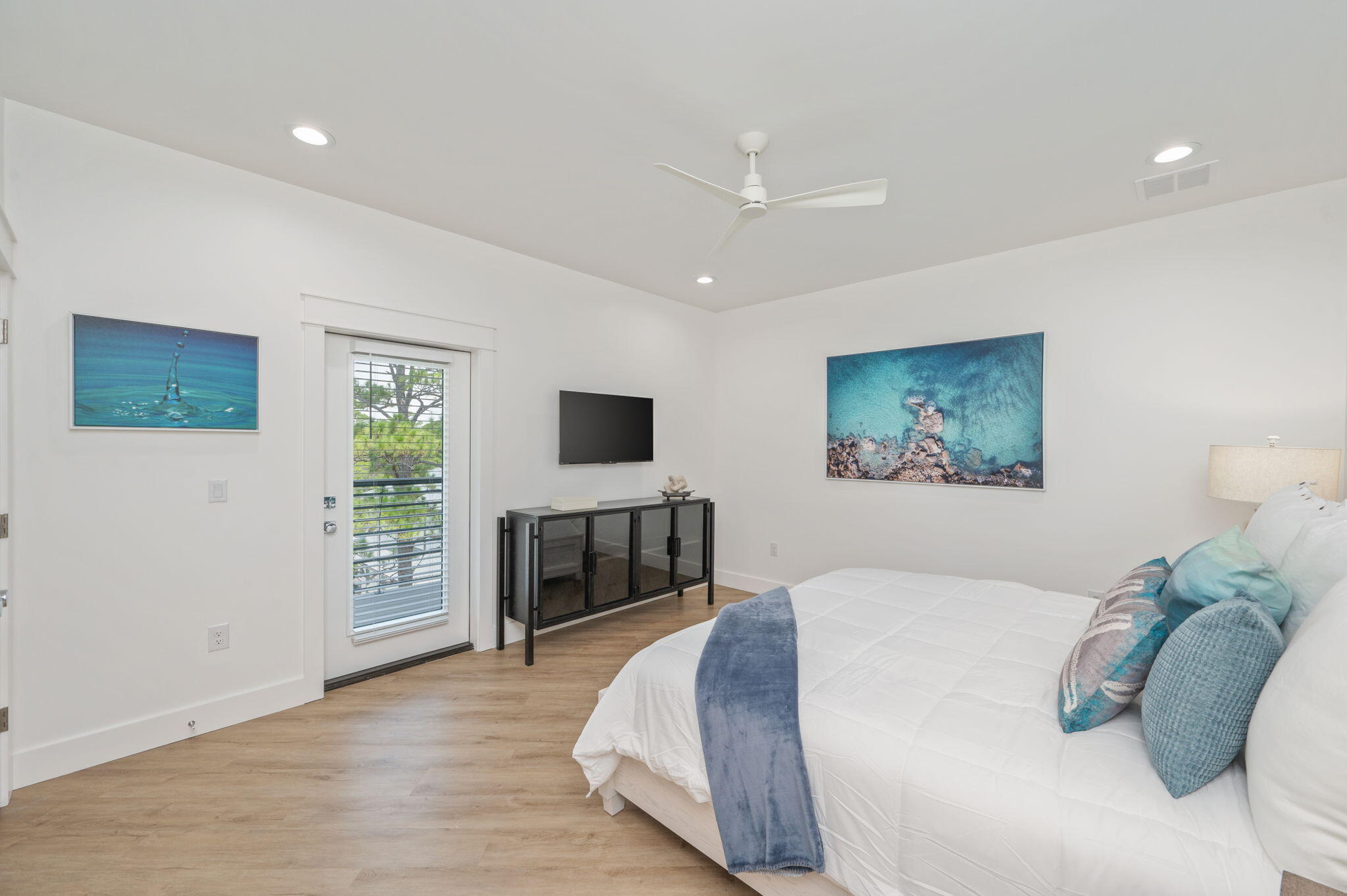6508 West County Highway 30A Santa Rosa Beach, FL 32459 - Photo 61 of 75 a spacious bedroom with a bed and a flat screen tv