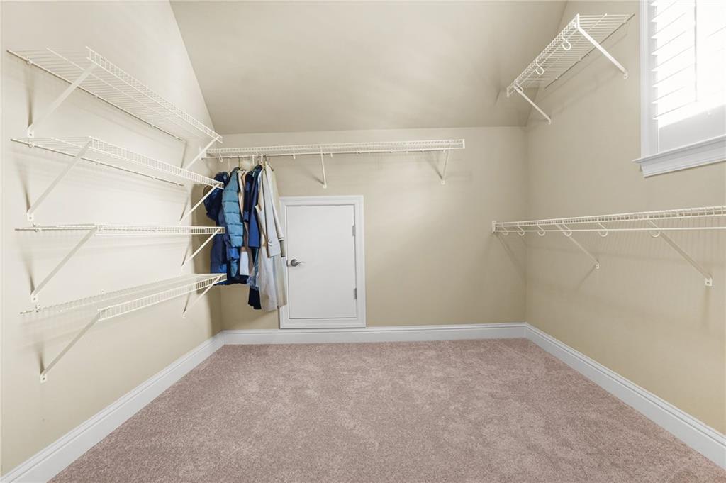 955 Gardiner Circle Suwanee, GA 30024 - Photo 26 of 44 a view of a room with racks on the wall