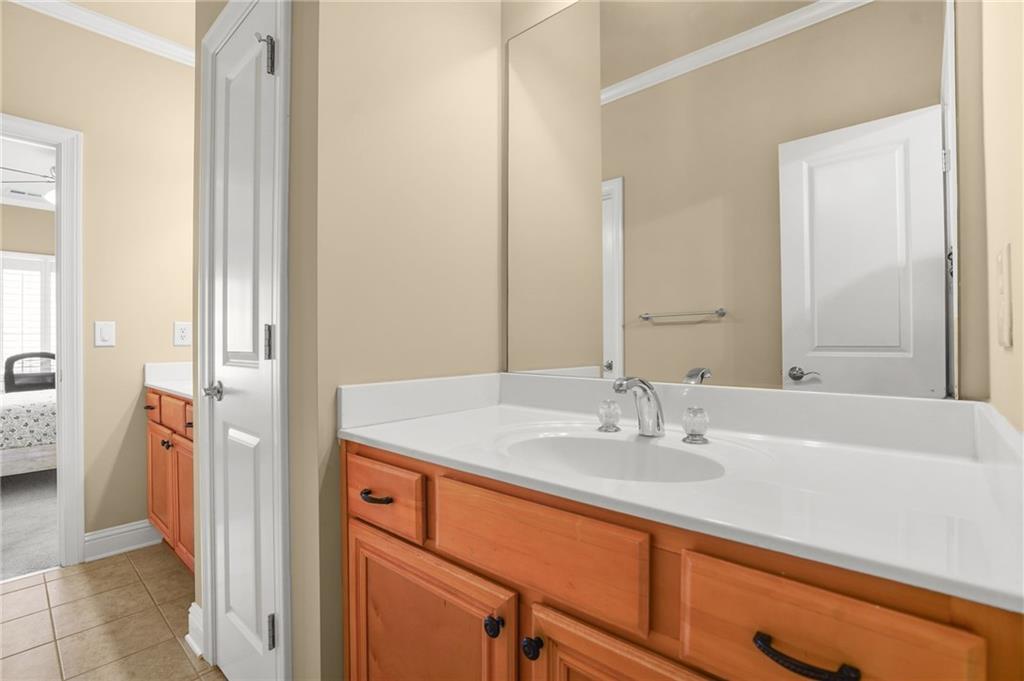 955 Gardiner Circle Suwanee, GA 30024 - Photo 28 of 44 a bathroom with a sink and a mirror