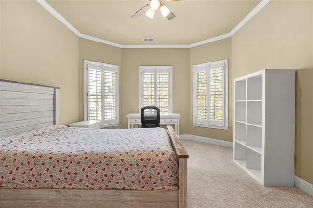 a room with a bed and a chandelier