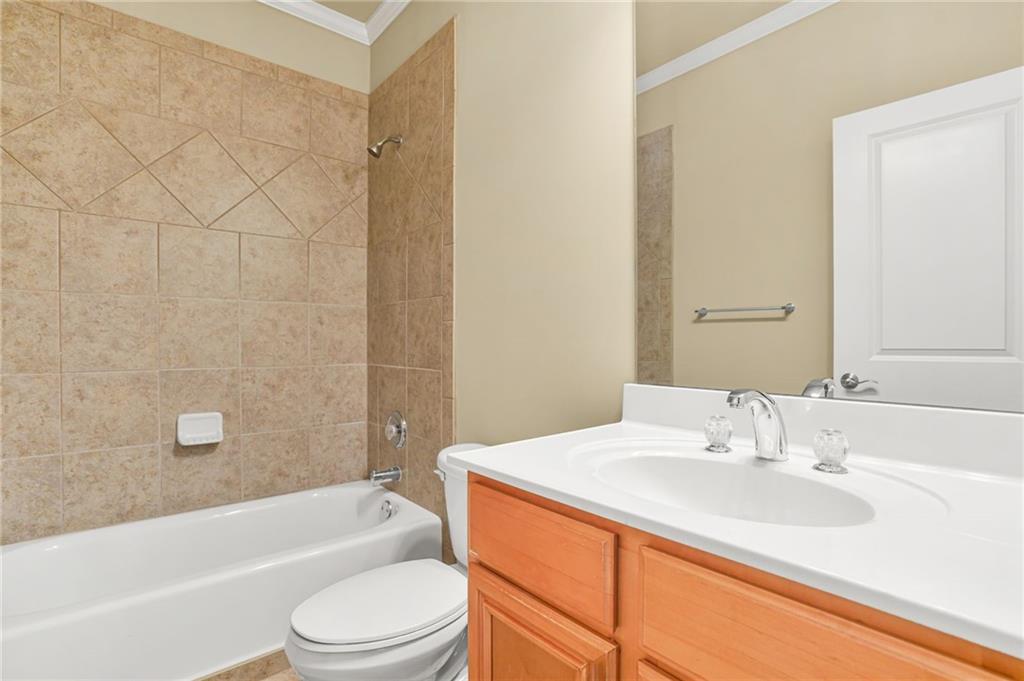 955 Gardiner Circle Suwanee, GA 30024 - Photo 31 of 44 a bathroom with a sink a toilet and bathtub