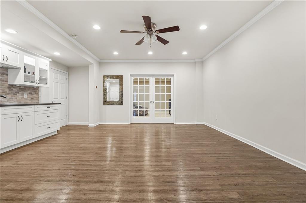 955 Gardiner Circle Suwanee, GA 30024 - Photo 33 of 44 a view of an empty room with window and cabinet