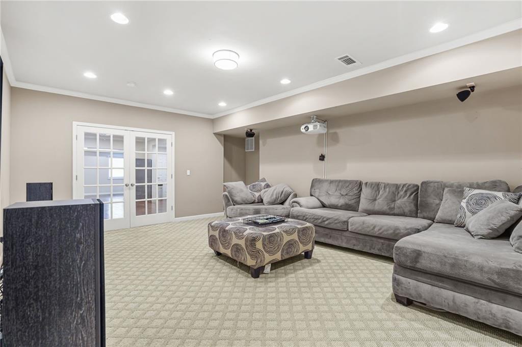 955 Gardiner Circle Suwanee, GA 30024 - Photo 37 of 44 a living room with furniture and a large window