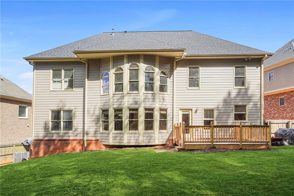 955 Gardiner Circle Suwanee, GA 30024 - Photo 40 of 44 a front view of a house with a yard