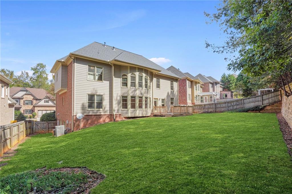 955 Gardiner Circle Suwanee, GA 30024 - Photo 42 of 44 a front view of a house with garden