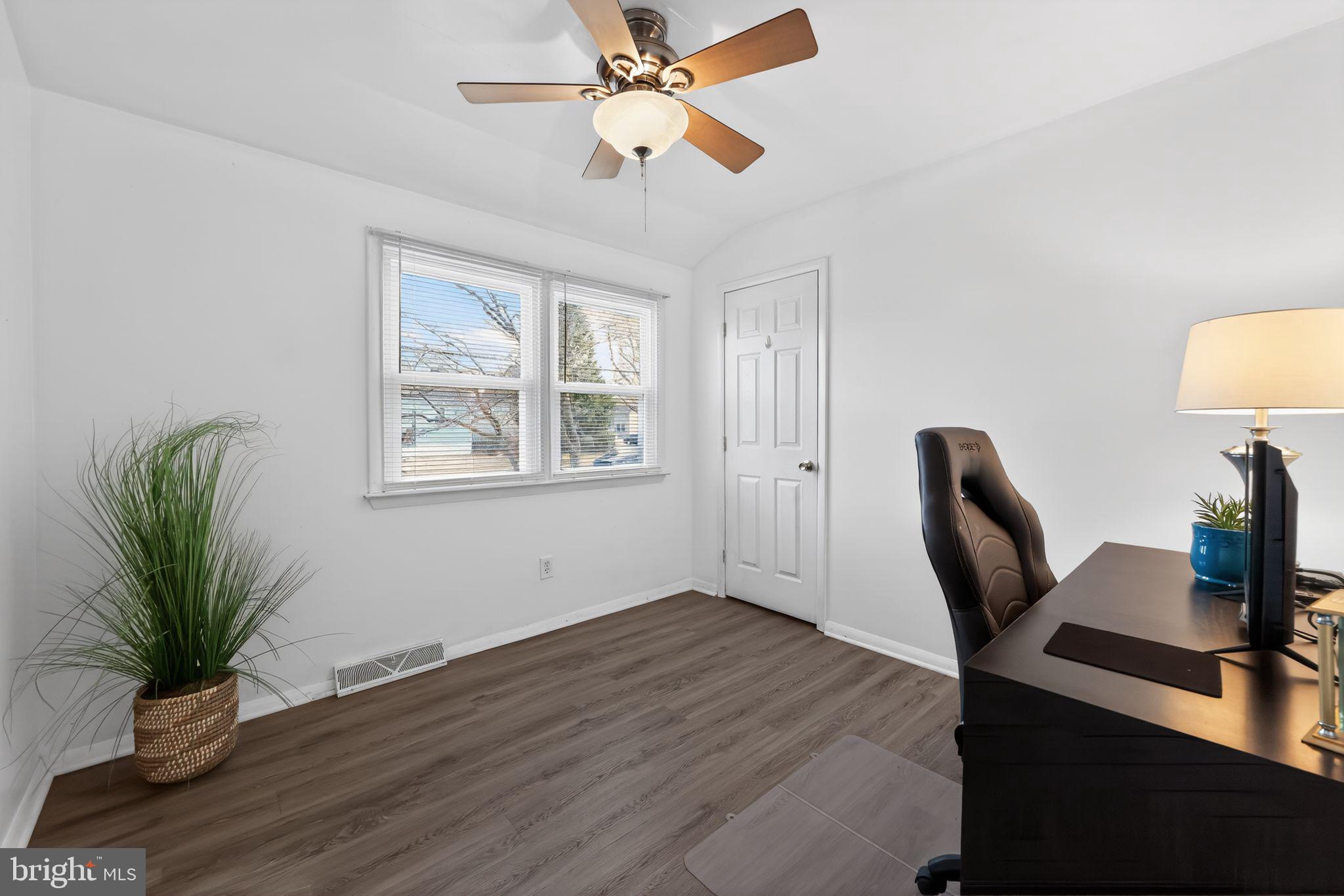 940 Carter Avenue Bellmawr, NJ 08031 - Photo 19 of 33 a view of a workspace with furniture and a window