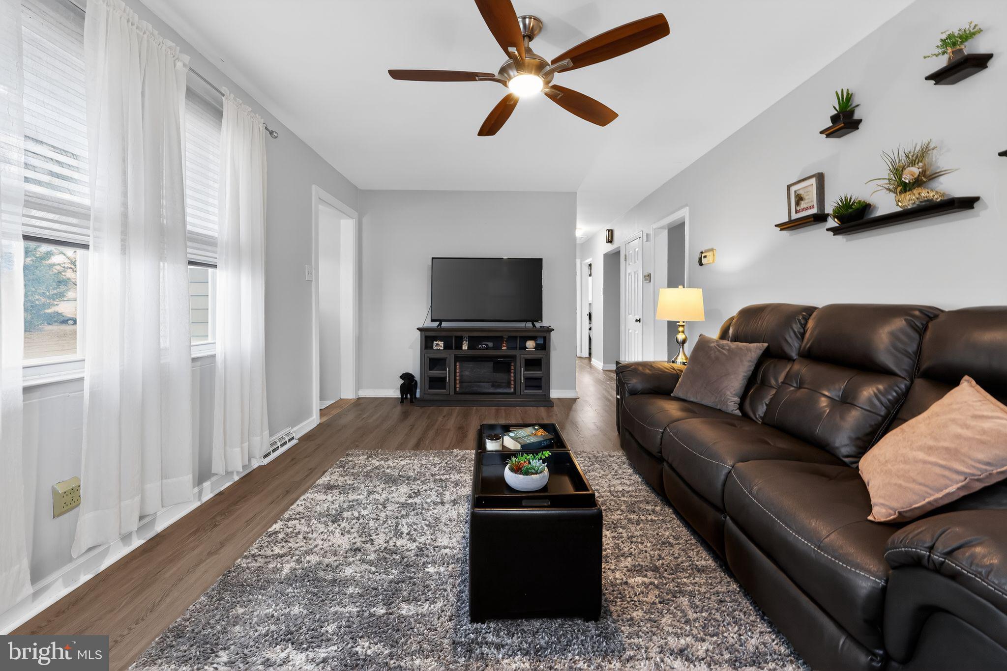 940 Carter Avenue Bellmawr, NJ 08031 - Photo 10 of 33 a living room with furniture and a flat screen tv