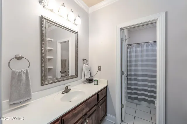 a bathroom with a sink vanity and a mirror