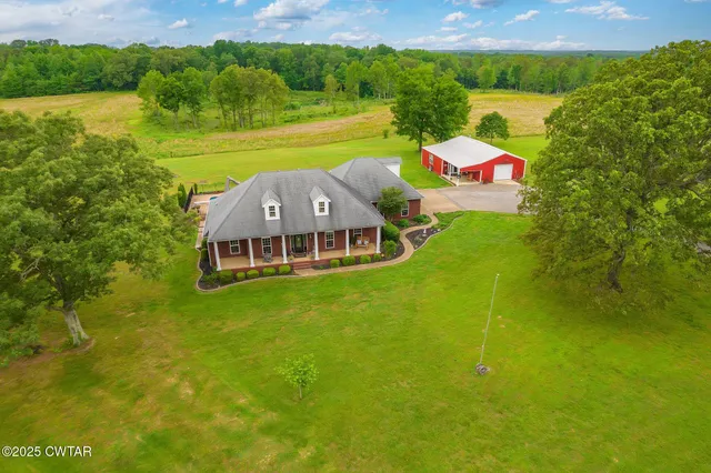 a view of a house with a big yard