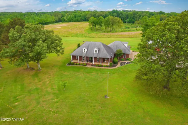 a view of a lake with a yard
