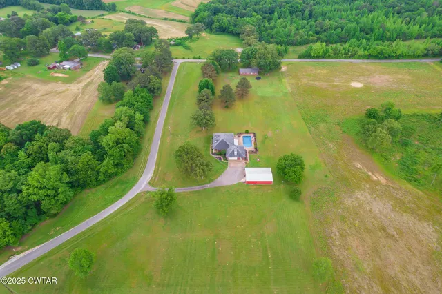 a view of a lake with a yard