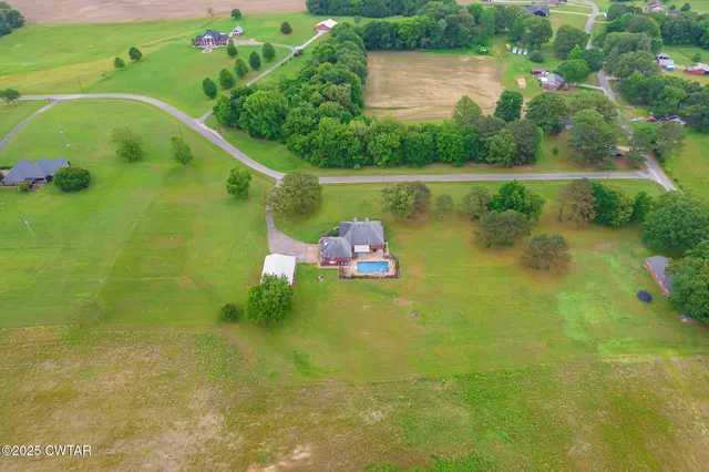 a backyard of a house with lots of green space