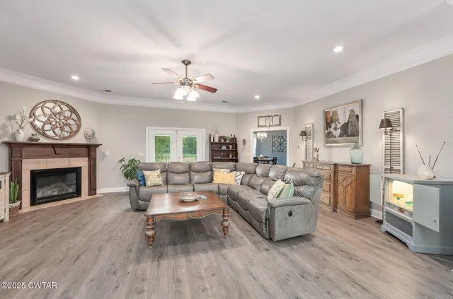 a living room with furniture and a fireplace