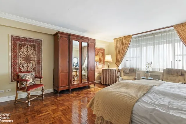 a living room with furniture rug and a window
