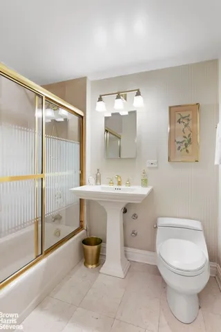 a kitchen with granite countertop wooden cabinets a sink and dishwasher