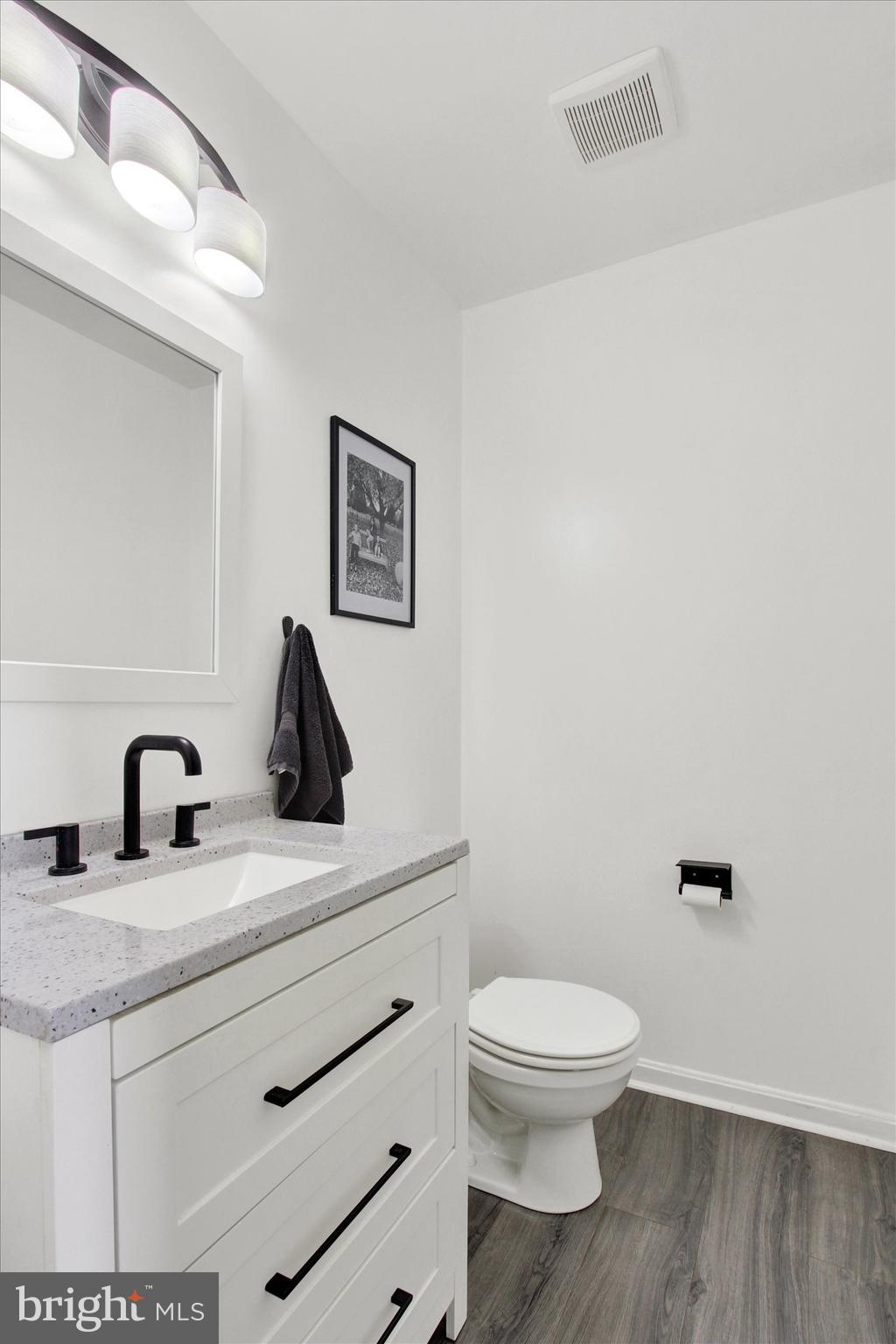 80 Galaxy Drive Hanover, PA 17331 - Photo 11 of 26 a bathroom with a toilet a sink and mirror