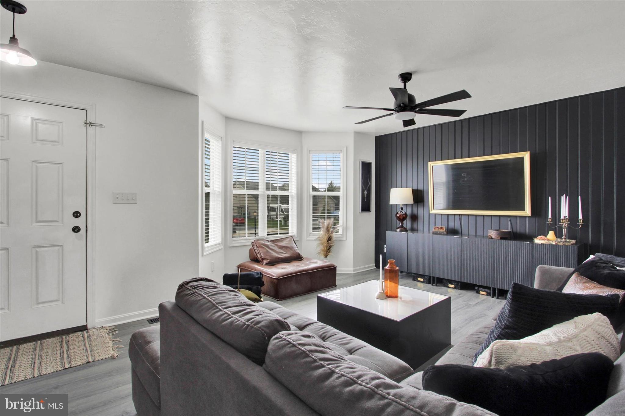 80 Galaxy Drive Hanover, PA 17331 - Photo 2 of 26 a living room with furniture and a flat screen tv