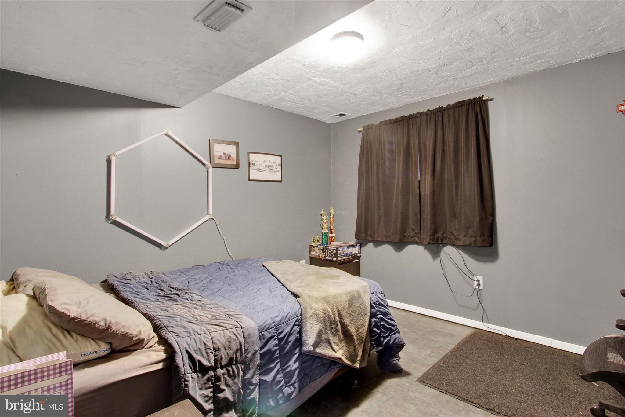 80 Galaxy Drive Hanover, PA 17331 - Photo 21 of 26 a bedroom with a bed and a lamp with the wooden floor