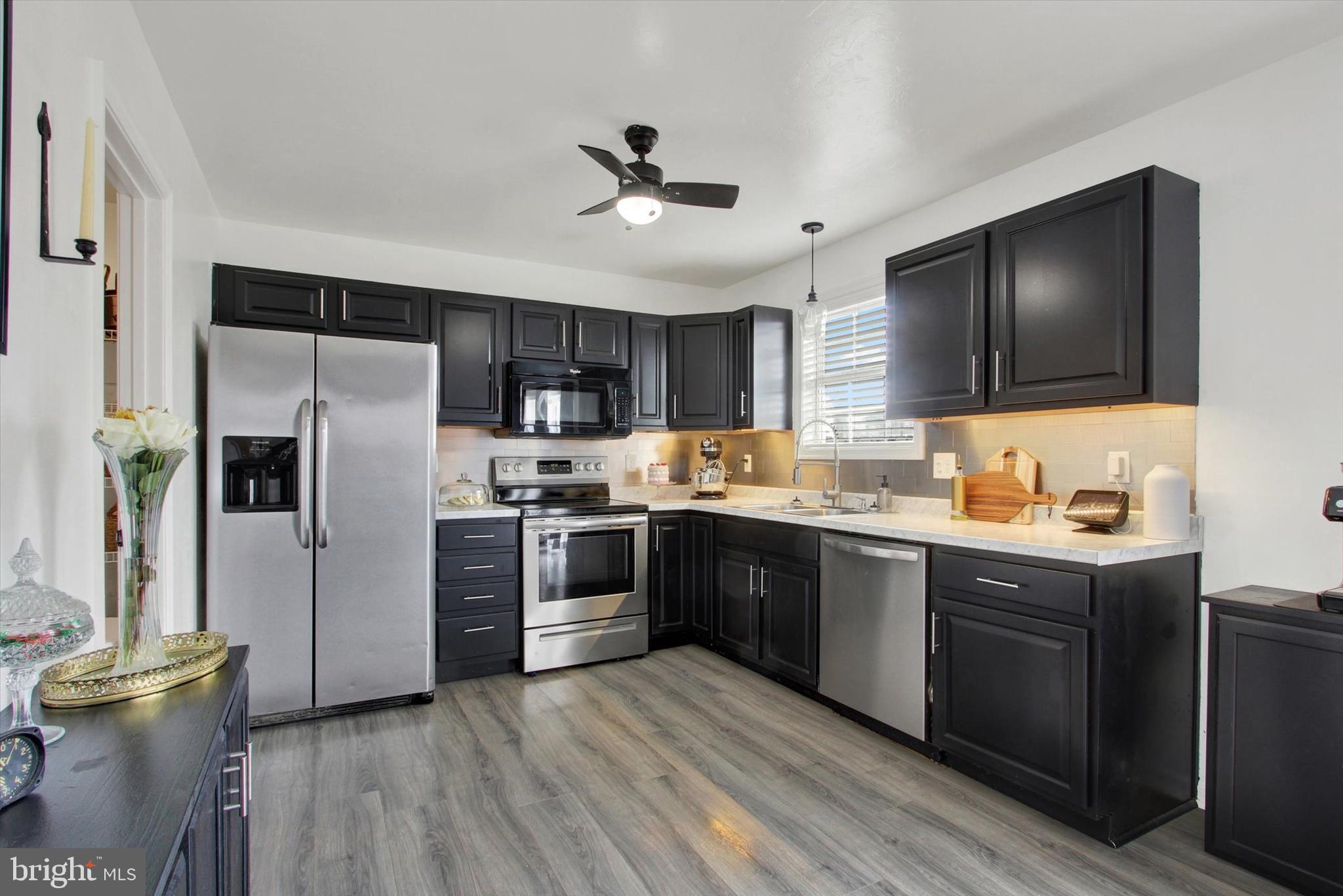 80 Galaxy Drive Hanover, PA 17331 - Photo 7 of 26 a kitchen with a sink stainless steel appliances and cabinets