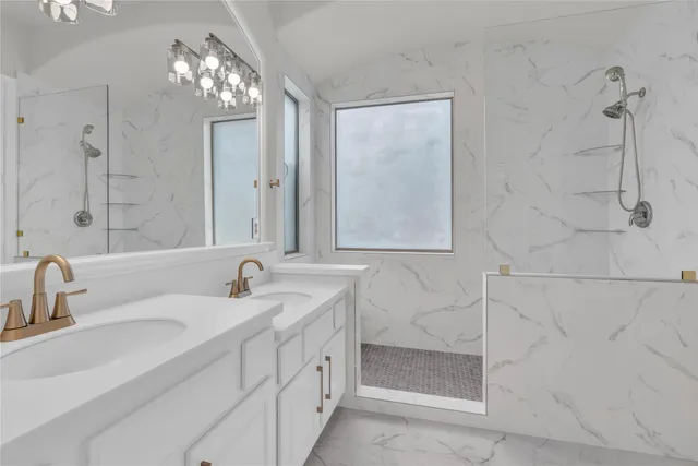 a bathroom with double sink and a mirror