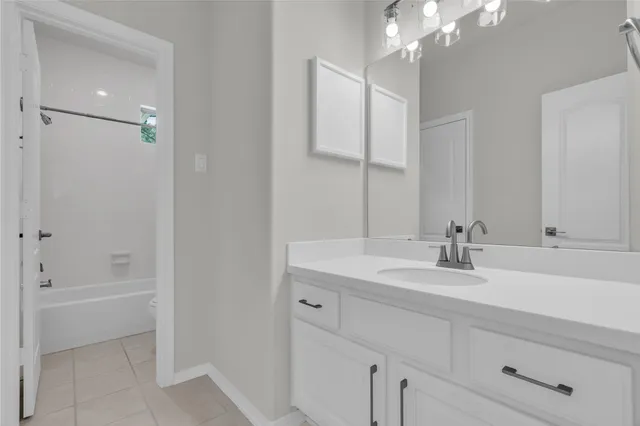 a bathroom with a sink a vanity and a mirror