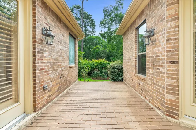 a view of a brick buildings with wooden floor and windows